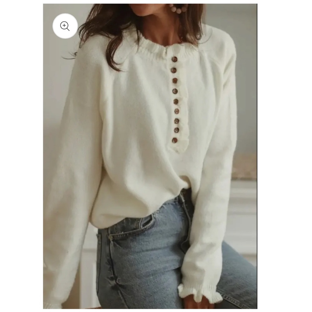 Cream button up sweater with ruffle sleeves and neck